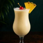 Коктейль Безалкогольна піна колада (Virgin/Baby Colada) у келиху Hurricane з часточкою ананаса і вишнею